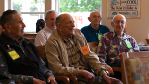attendees sitting together and singing